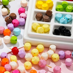 Macro shot of 10mm colorful macaron acrylic rhombic beads for DIY jewelry making and crafts