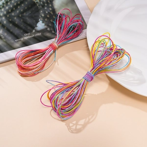 Macro detail of 1mm multi-color gradient waxed polyester cords for DIY jewelry weaving