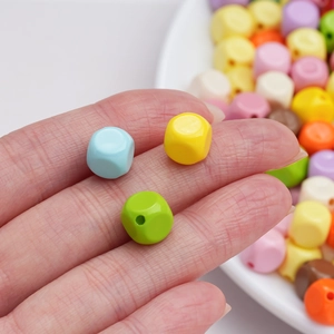 Macro shot of 10mm macaron acrylic cube beads with center holes for DIY jewelry making