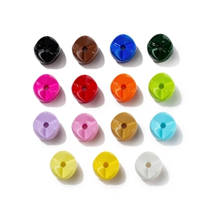 Macro shot of 15 colorful glossy resin beads with smooth finish for DIY jewelry