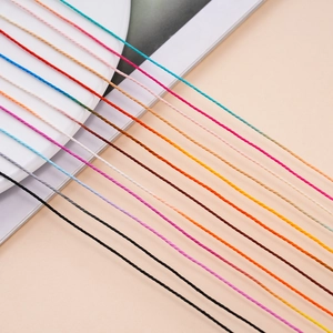 Close-up of colorful 1mm waxed polyester cords for DIY jewelry weaving and beading projects
