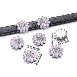 Pink enamel flower charm with crystals on a black leather bracelet, detailed size view