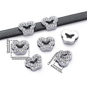 Macro detail of alloy butterfly slide beads with rhinestones for 8mm leather straps