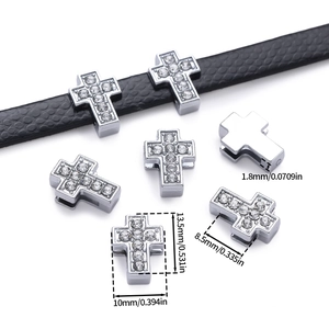 Macro view of rhinestone-encrusted cross slider bead with dimensions for DIY jewelry