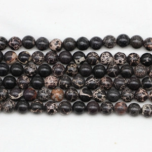 Detail view of round India Agate beads with natural brown and white stone textures