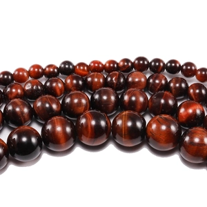 Perle tonde in occhio di tigre rosso lucidato in quattro dimensioni per gioielli