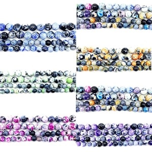 Detailed close-up of natural stone round beads in various colors for DIY jewelry making