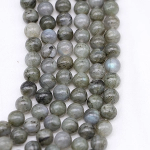Perle in labradorite naturale con riflessi blu e superficie rotonda lucida di qualità