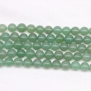 Close-up of polished 8mm green bamboo leaf agate round beads for DIY jewelry making