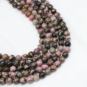 Polished natural Rhodonite round beads with unique pink and black marble textures