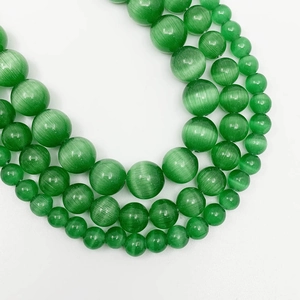 Set of green cat eye round loose beads in multiple sizes for jewelry making