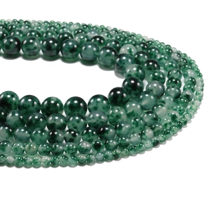 Plusieurs rangs de perles rondes en jade quartzite vert poli avec motifs floraux bleus