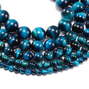 Perle tonde in occhio di tigre blu naturale con effetto occhio di gatto per gioielli