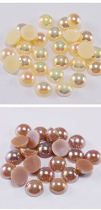 Macro detail of flatback iridescent ABS half pearls in cream and caramel tones for DIY crafts