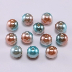 Detail of blue and pink gradient ABS imitation pearls with holes for DIY jewelry