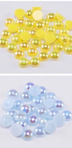 Close-up of flatback ABS imitation pearls with iridescent AB coating for DIY crafts