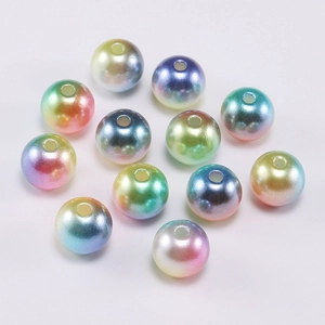 Close-up of gradient rainbow ABS imitation pearls with holes for DIY jewelry making