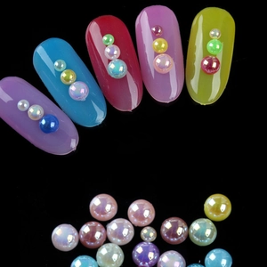 Macro detail of iridescent colorful ABS imitation pearls for nail art and DIY decor