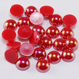 Macro view of red AB coated half-round pearls for DIY craft and nail art decoration