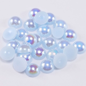 Macro view of light blue AB iridescent half-round flatback pearls for DIY jewelry crafts