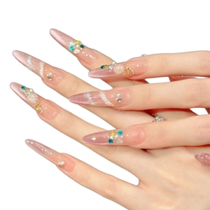 Pink cat-eye stiletto press-on nails with 3D pearls and golden star charms