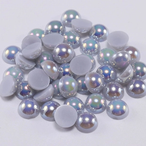 Macro view of flatback half-round grey AB coated faux pearls for DIY nail art and crafts