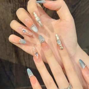 Baroque cat eye press-on nails with blue orange gradient and 3D gold accents