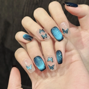 Sparkling dark blue cat eye press-on nails with 3D butterfly ornaments for women