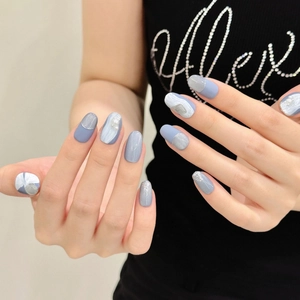 Glacier blue and grey cat eye press-on nails with marble texture and pearl accents