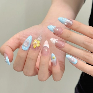 Blue and pink sea shell press-on nails with 3D pearls, starfish, and glitter details