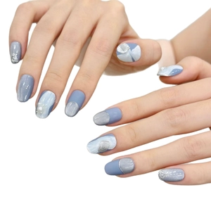 Short blue cat-eye press-on nails with silver marble texture and pearl accents