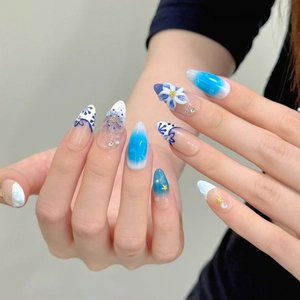 Blue ocean style almond shape press-on nails with 3D flower and rhinestone detailing