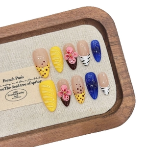 3D floral and leopard print press-on nails with wave textures in blue and yellow