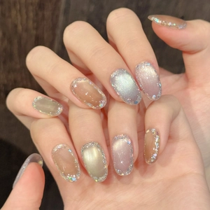Elegant cat eye and amber brown oval press-on nails with shiny glitter accents