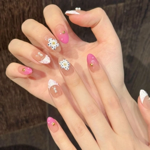 Pink gradient almond press-on nails with 3D white flowers, pearls and star studs