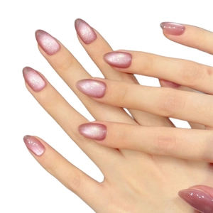 Sparkling pink cat eye almond press-on nails with fine glitter shimmer and oval shape