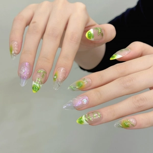 Fresh green almond press-on nails with 3D floral vines and pearl accents for women