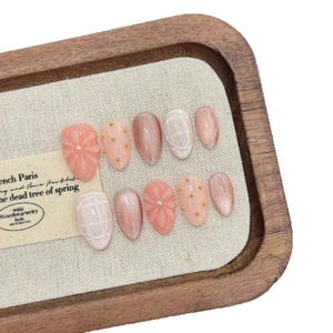Japanese style nude cat-eye press-on nails with 3D floral accents and pearls