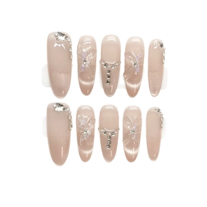 Elegant long almond press-on nails in nude pink cat-eye effect with 3D butterfly and pearls