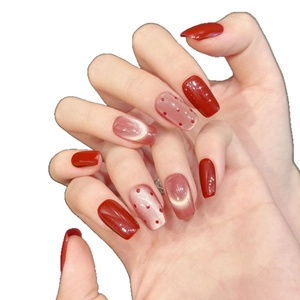 Elegant red polka dot and cat-eye short press-on nails for a minimalist manicure style