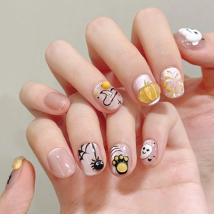 3D Halloween press-on nails featuring pumpkin, ghost, and black cat relief art on pink base
