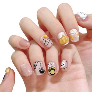 Halloween 3D press-on nails featuring pumpkin, ghost, and spider motifs with purple glitter