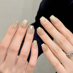 Short square press-on nails with 3D floral relief in green gradient and cat eye finish