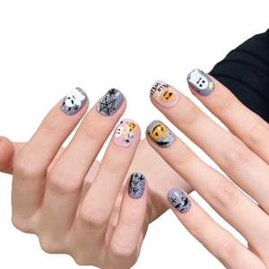 Purple Halloween press-on nails featuring pumpkin, ghost, and spider web hand-painted art