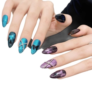 Blue and purple cat eye press-on nails with butterfly charms and silver chains