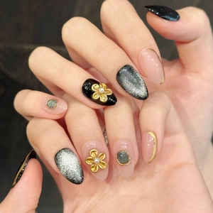 Elegant bronze hand-painted fake nails with cat eye effect and gold embossed floral design