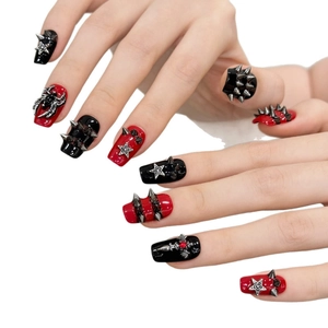 Gothic punk press-on nails in red and black with silver studs and spider charms