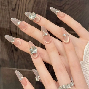 Sparkling ice tea champagne cat eye press-on nails with luxury rhinestones and almond shape