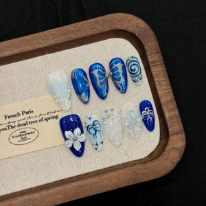 Deep blue and white handmade stiletto press-on nails with 3D flower and butterfly art