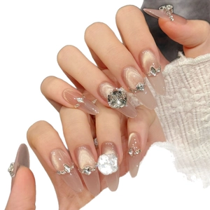 Long almond cat eye press-on nails with luxury champagne crystals and rhinestone accents
